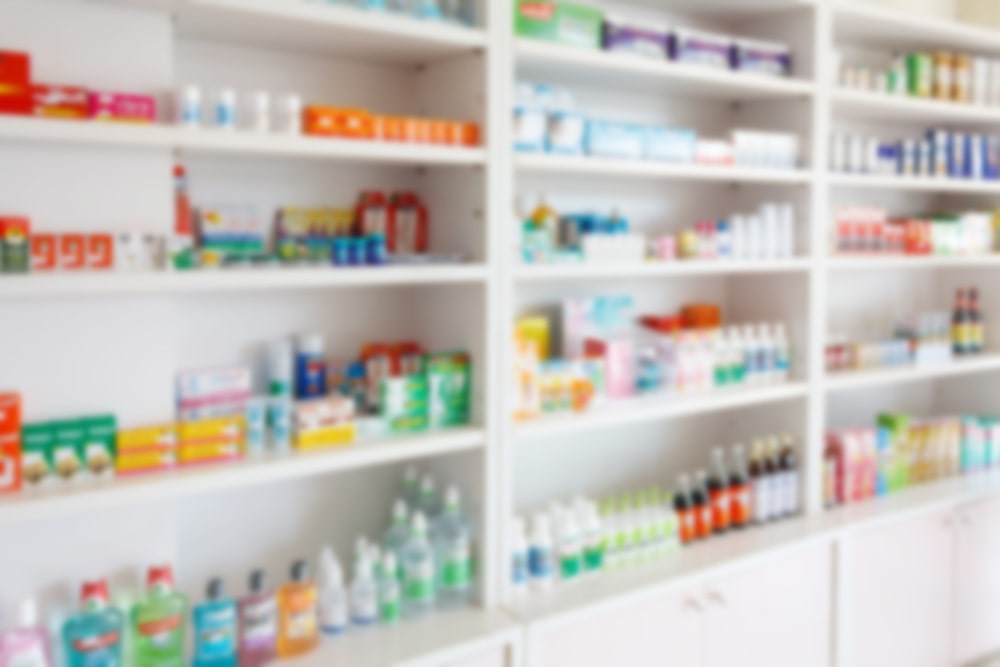 blurred image of vitamins on supermarket shelves